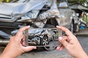 a man who was injured in a car accident taking pictures