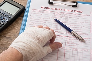 a work injury claim form being filed with the help of a personal injury attorney