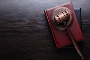 gavel on top of consumer fraud law books