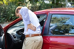 Man with back pain after car accident