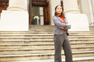 Native American woman standing in front of court