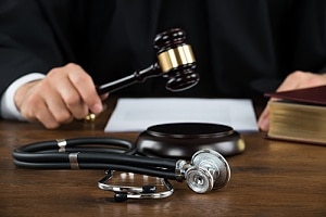 Judge with gavel and stethoscope 