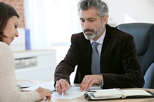 Lawyer showing paperwork to client