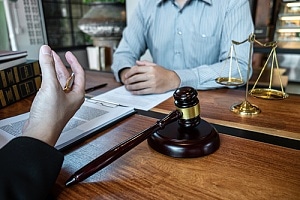 Wrongful death attorney talking to client 