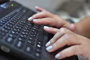 legal stenographer taking notes during a deposition