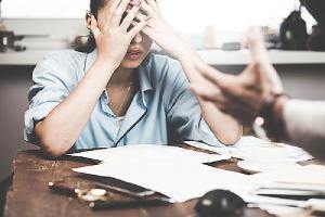 A young employee being harassed in her workplace