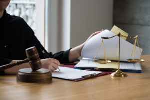 lawyer looks for a personal injury case document in the settlements folder