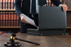 lawyer packs up suitcase after working on a personal injury case