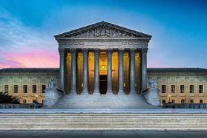 Illuminated United States Supreme Court building. The Civil Rights Act of 1964 clearly defined racial discrimination