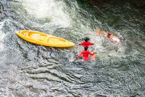 Rescuers helping an injured boating accident victim